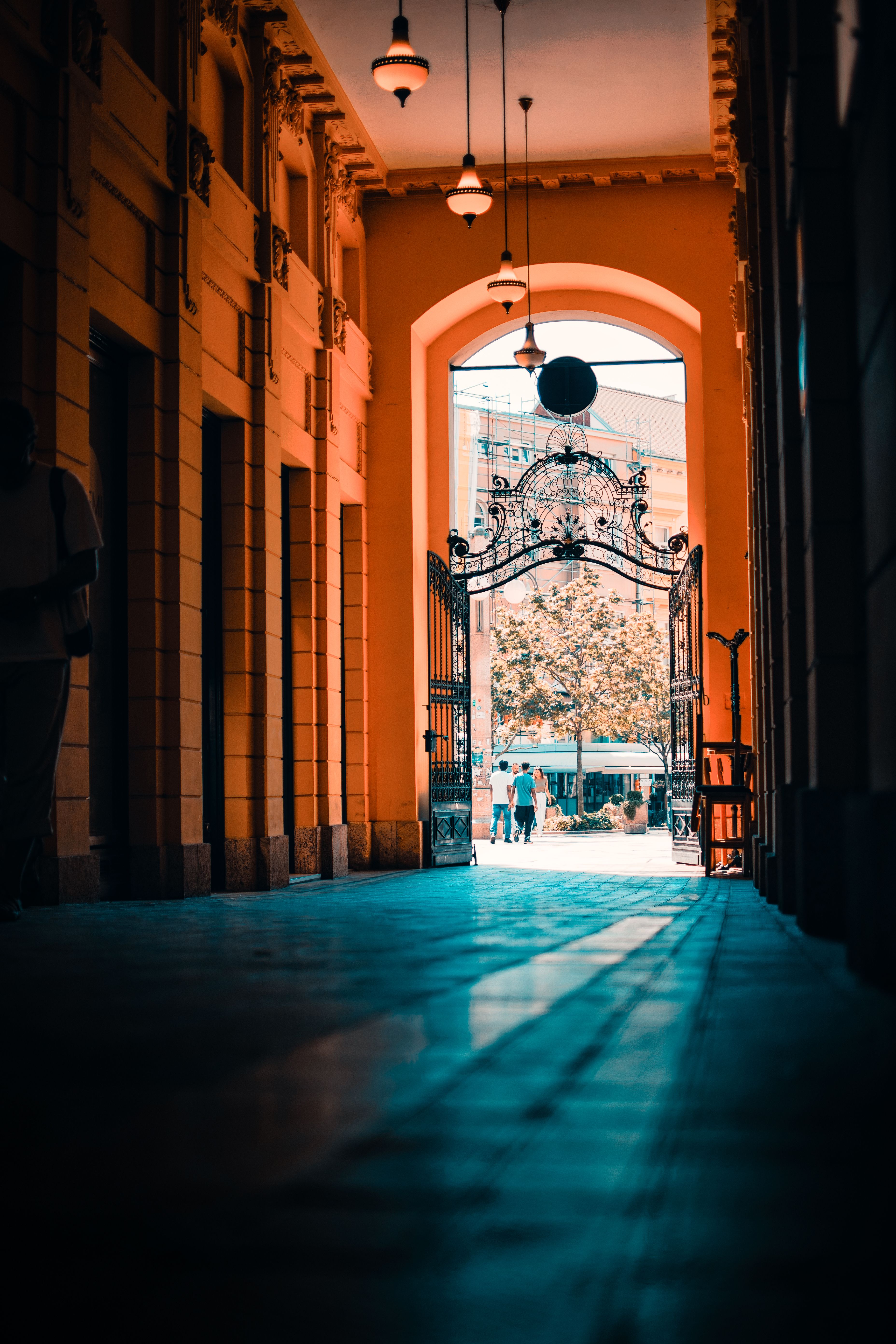 Historic Architectural Corridor with Iron Gate · Free Stock Photo