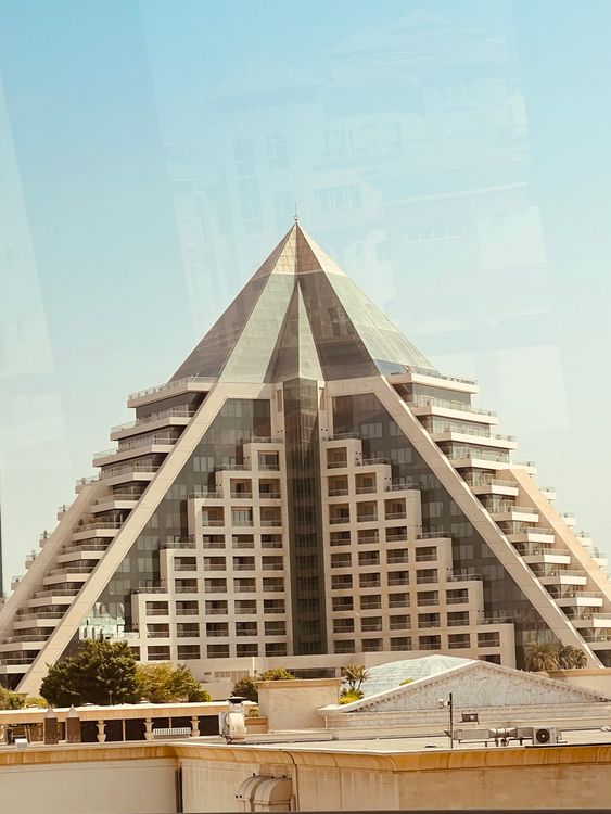 Long Rectangular Pyramid Building Pyramid-Shaped Modern Building Under Blue Sky · Free Stock Photo