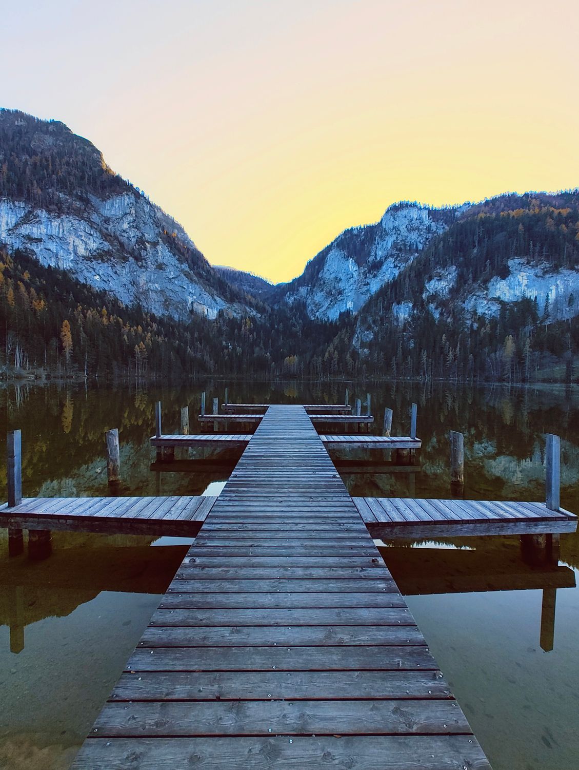 Tranquil Mountain Lake With Wooden Dock In Austria Free Stock Photo tranquil-mountain-lake-with-wooden-dock-in-austria-free-stock-photo