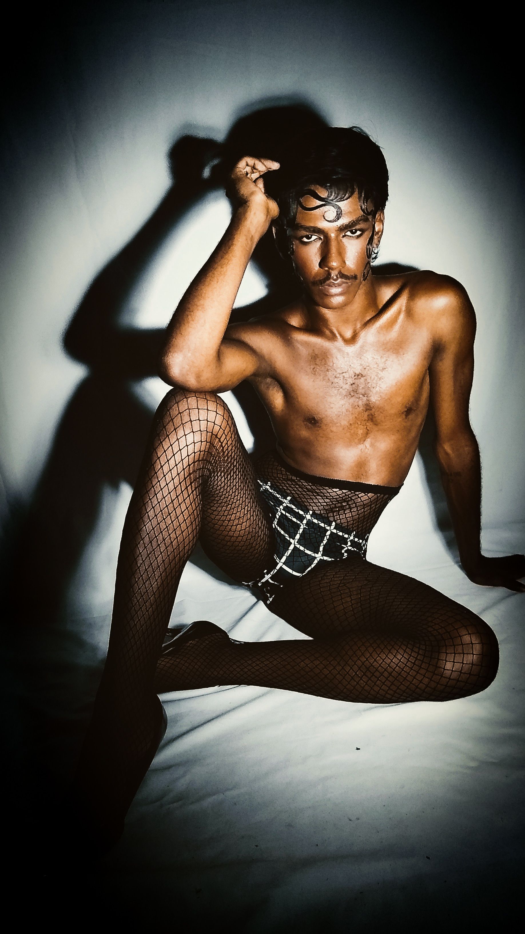 Artistic Portrait of Man in Fishnet Tights · Free Stock Photo