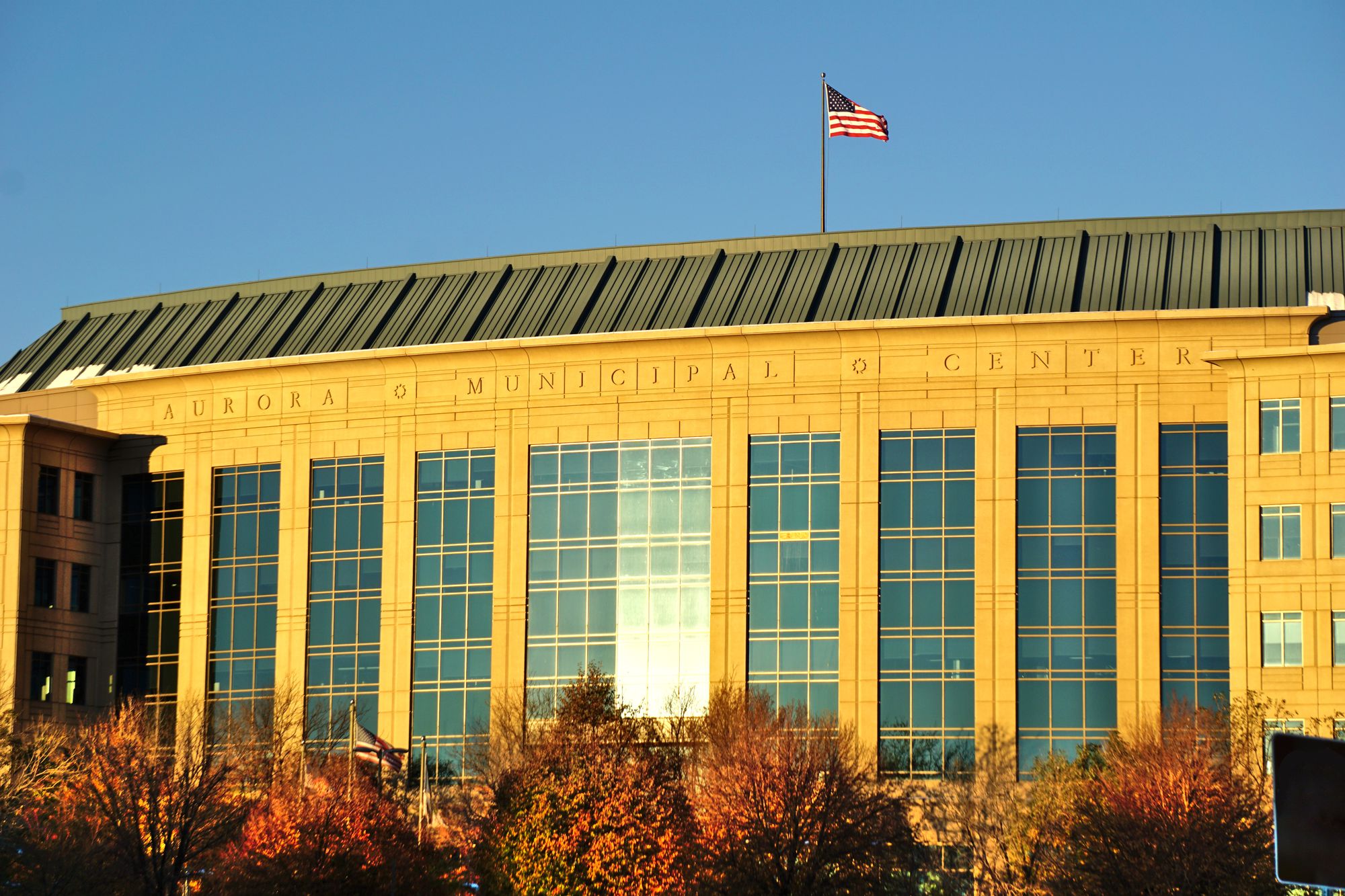 The Aurora Municipal Center building directly identifies the city government that approved the EV charger infrastructure&hellip;