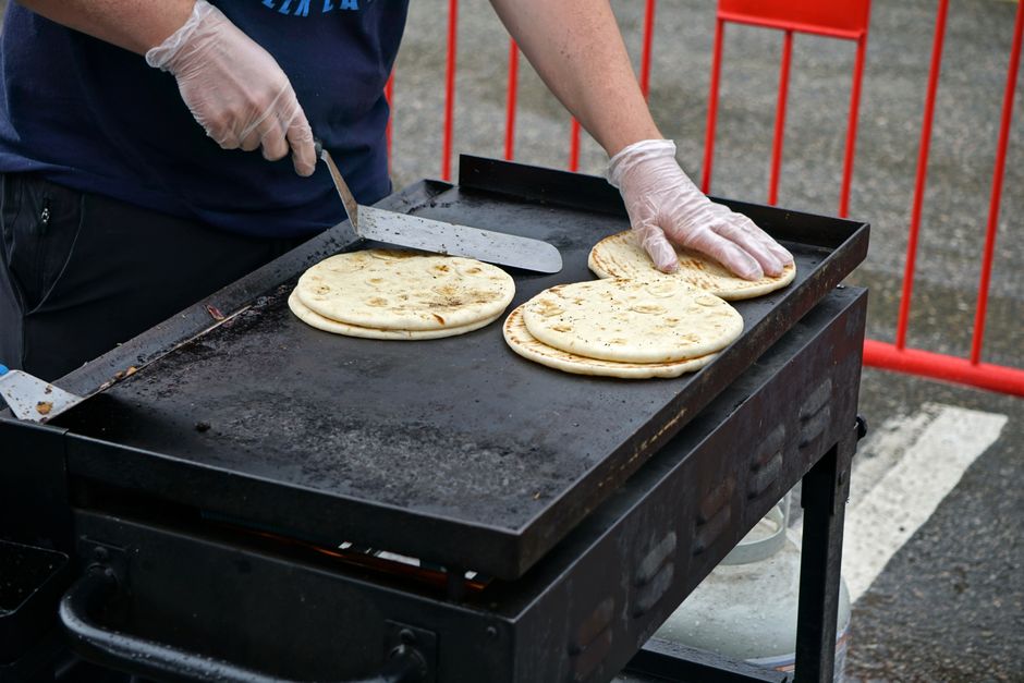 Indonesian street food vendor preparing safe and hygienic food
