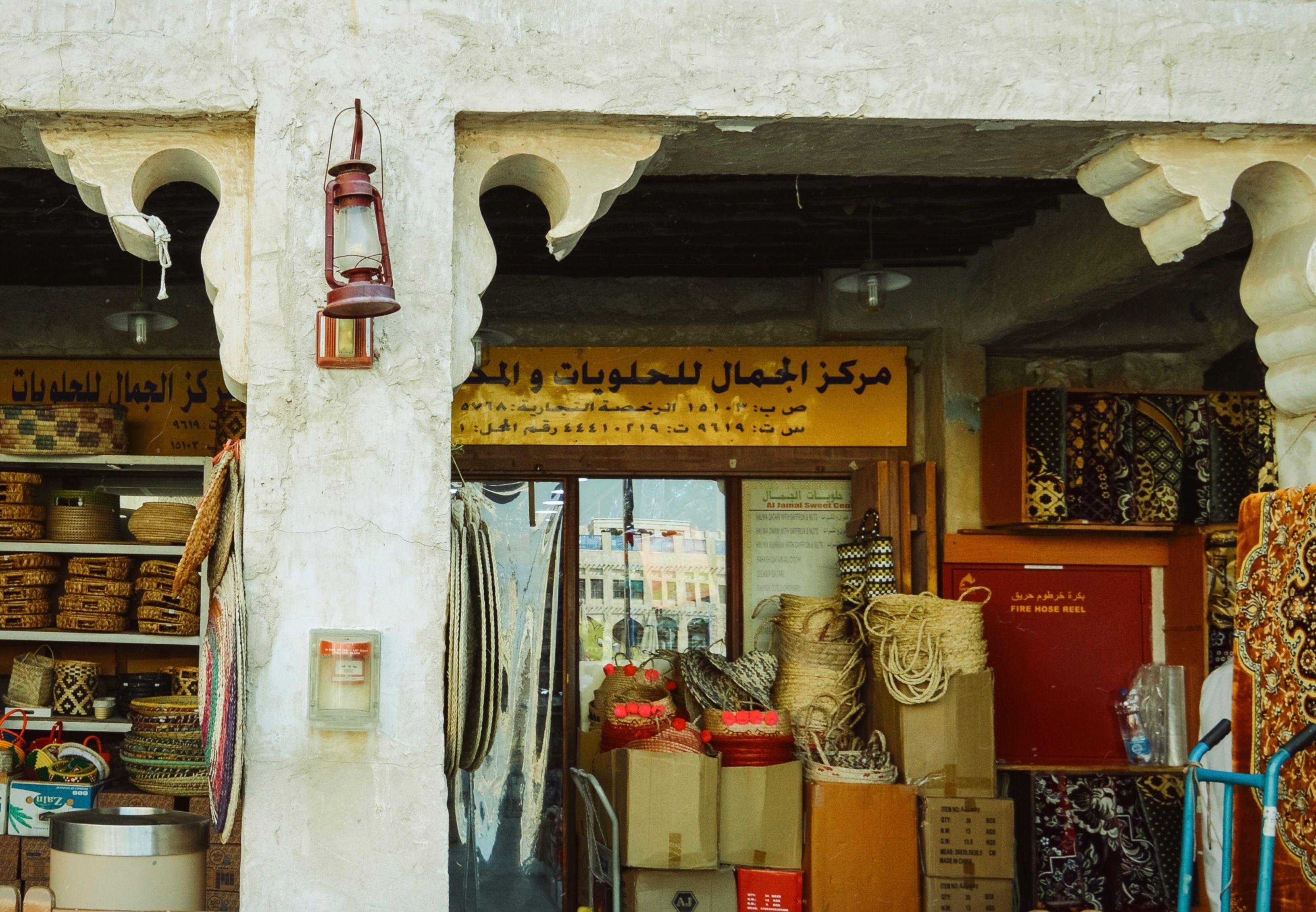 Bustling Manama Souq market in Bahrain with traditional goods and spices