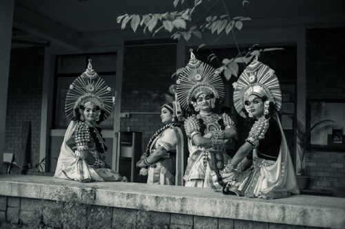 Free Black and white photo of traditional Indian dancers wearing elaborate costumes and makeup. Stock Photo