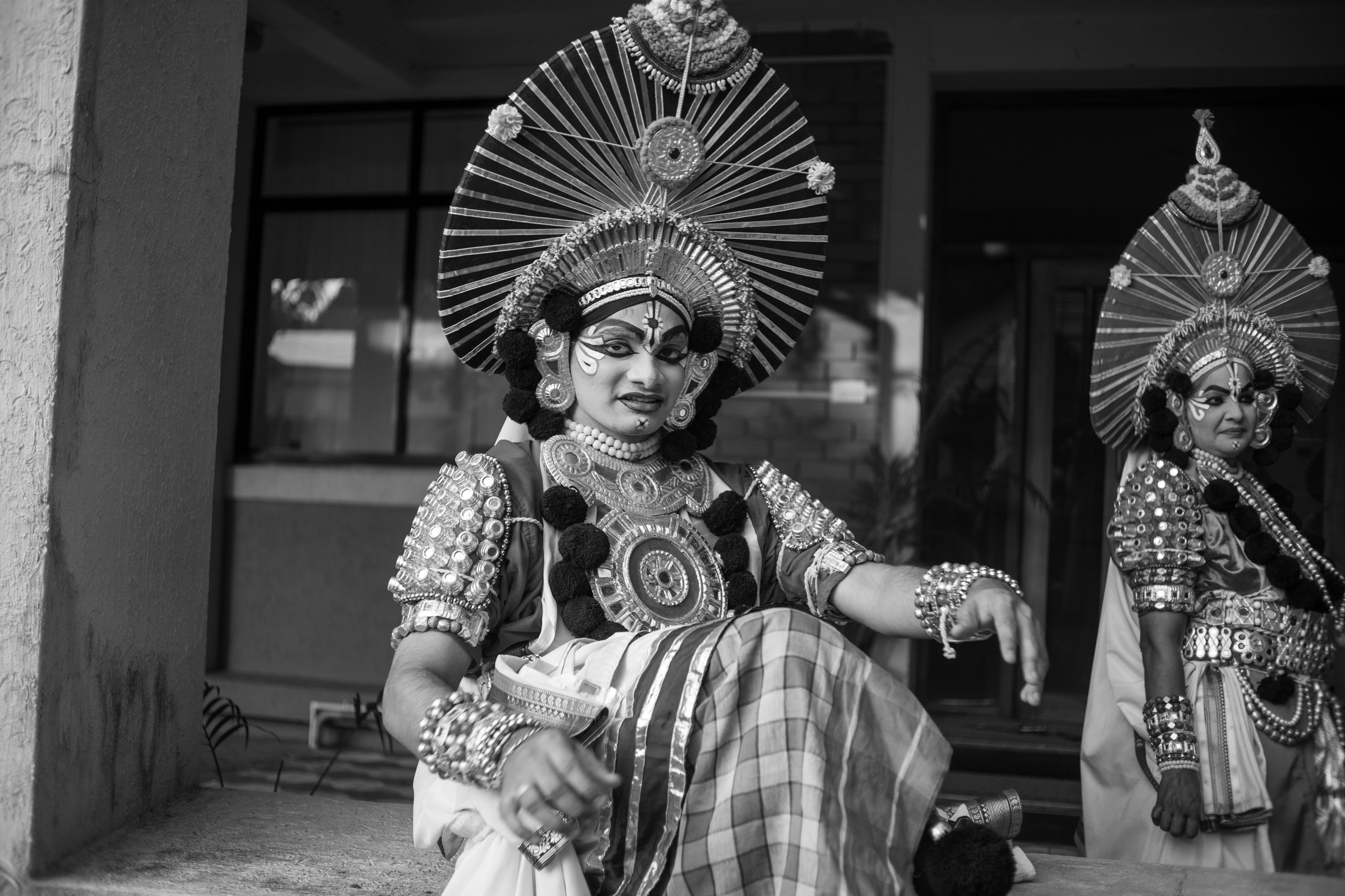 Free Black and white photo of Yakshagana performers in elaborate traditional costumes. Stock Photo