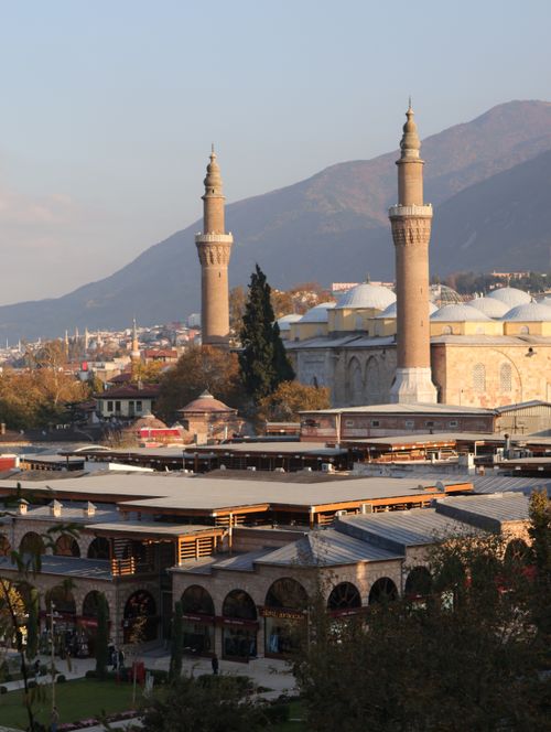 Free Elevated view of Bursa's historic Grand Mosque and urban landscape with distant hills. Stock Photo