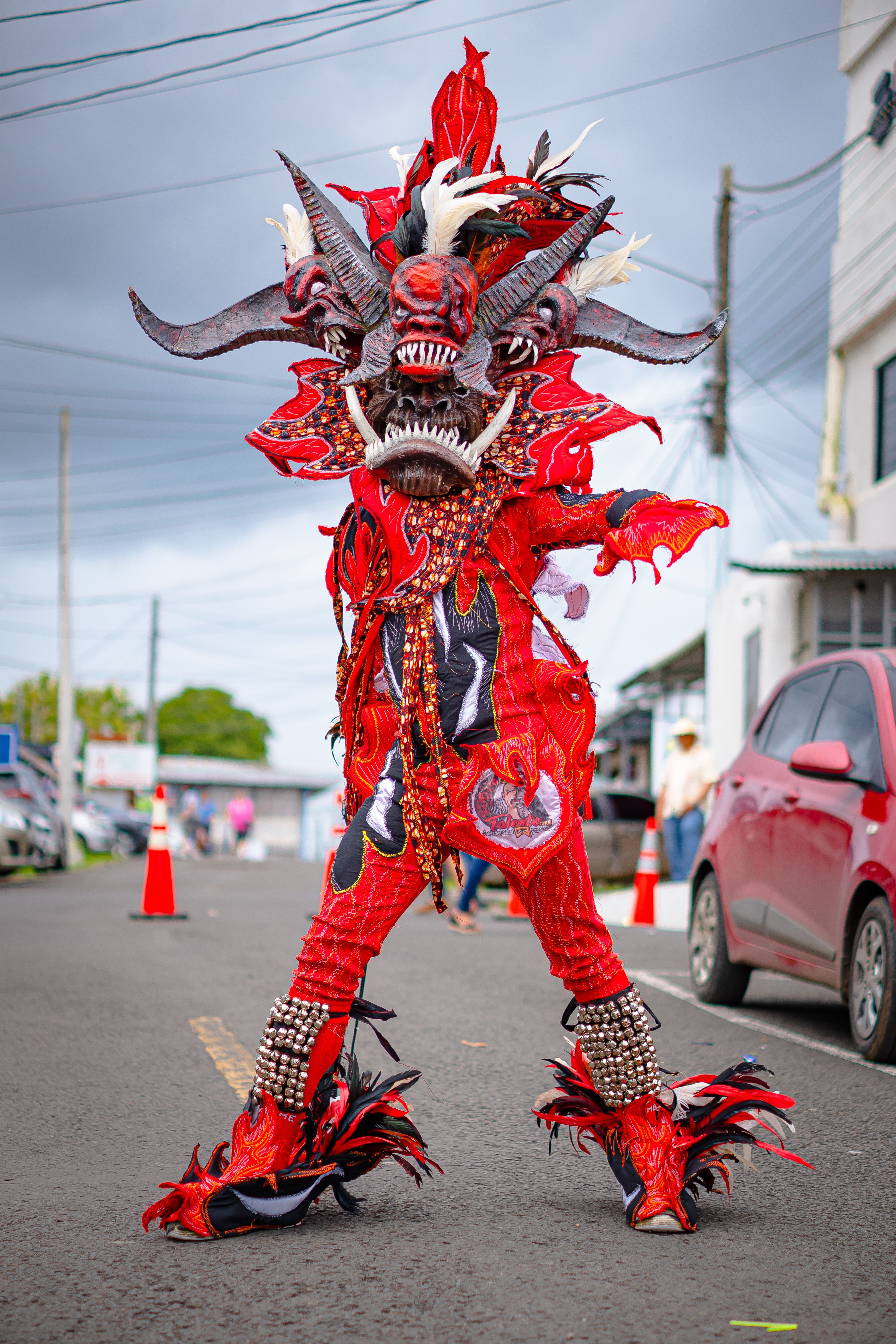 Vibrant Street Parade Performer in Red Costume · Free Stock Photo