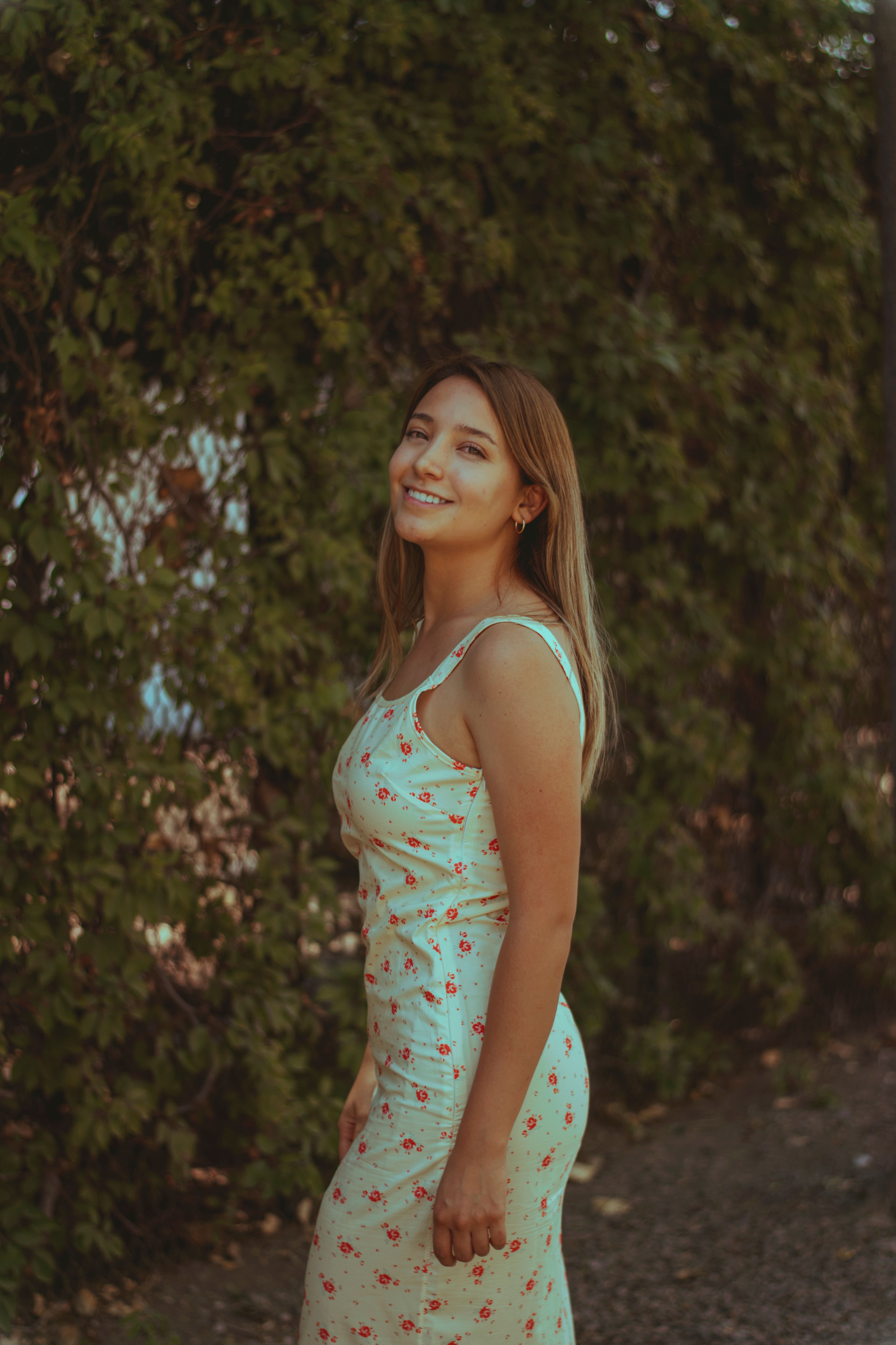 Portrait of a Smiling Woman Outdoors in Summer · Free Stock Photo