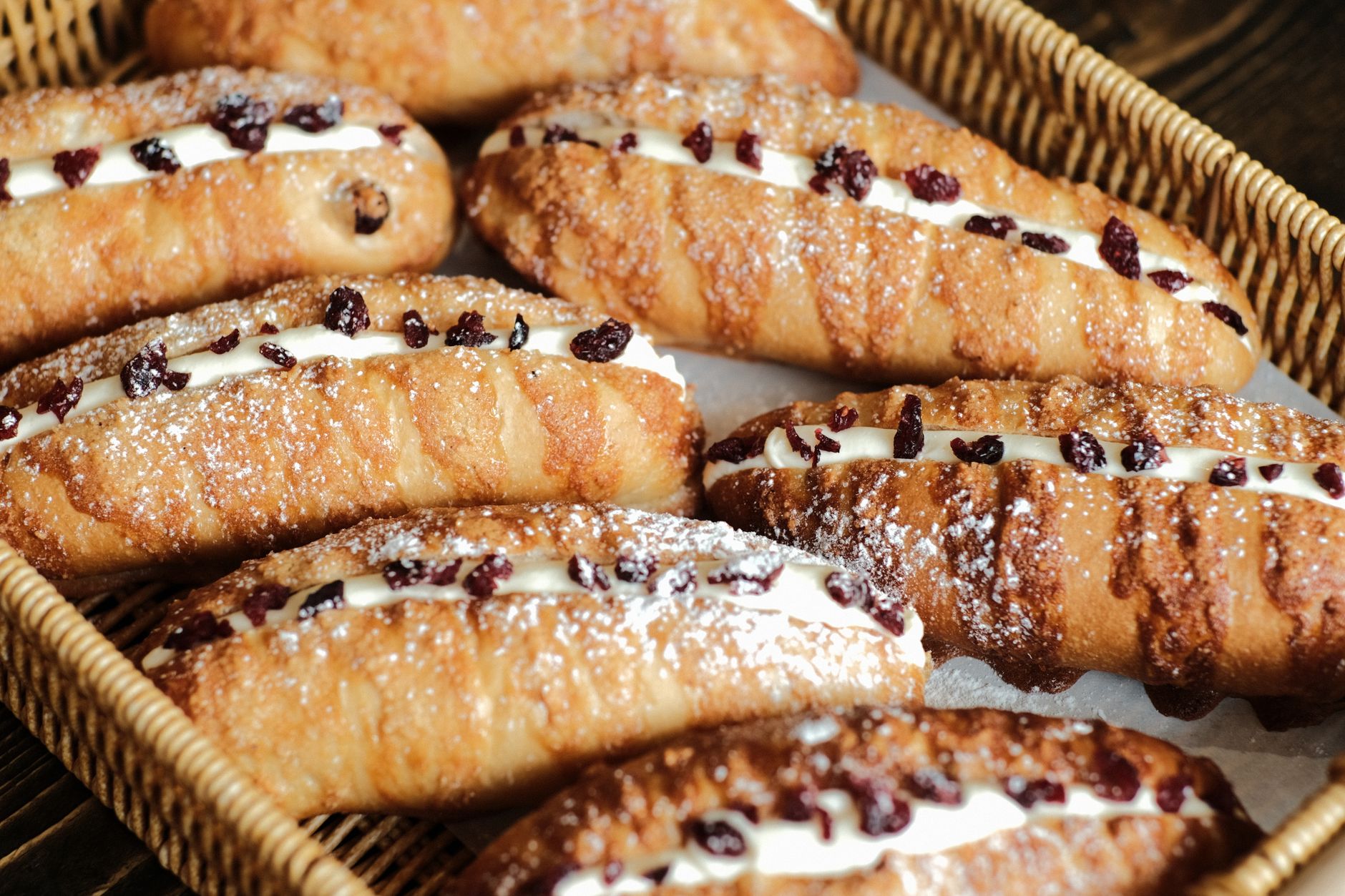 Delicious freshly baked breads with cream filling and cranberries in a Ho Chi Minh bakery.