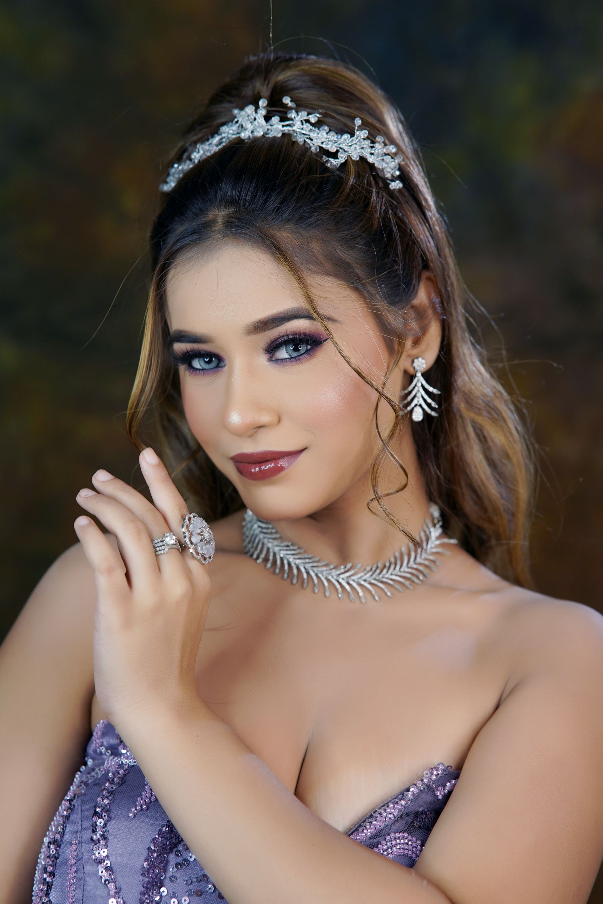 Woman wearing an elegant evening gown and jewelry