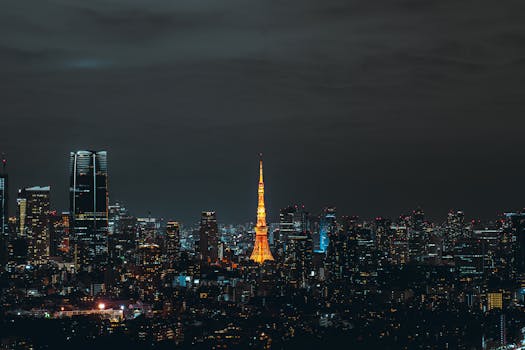 Stunning night view of Tokyo skyline featuring the illuminated Tokyo Tower.