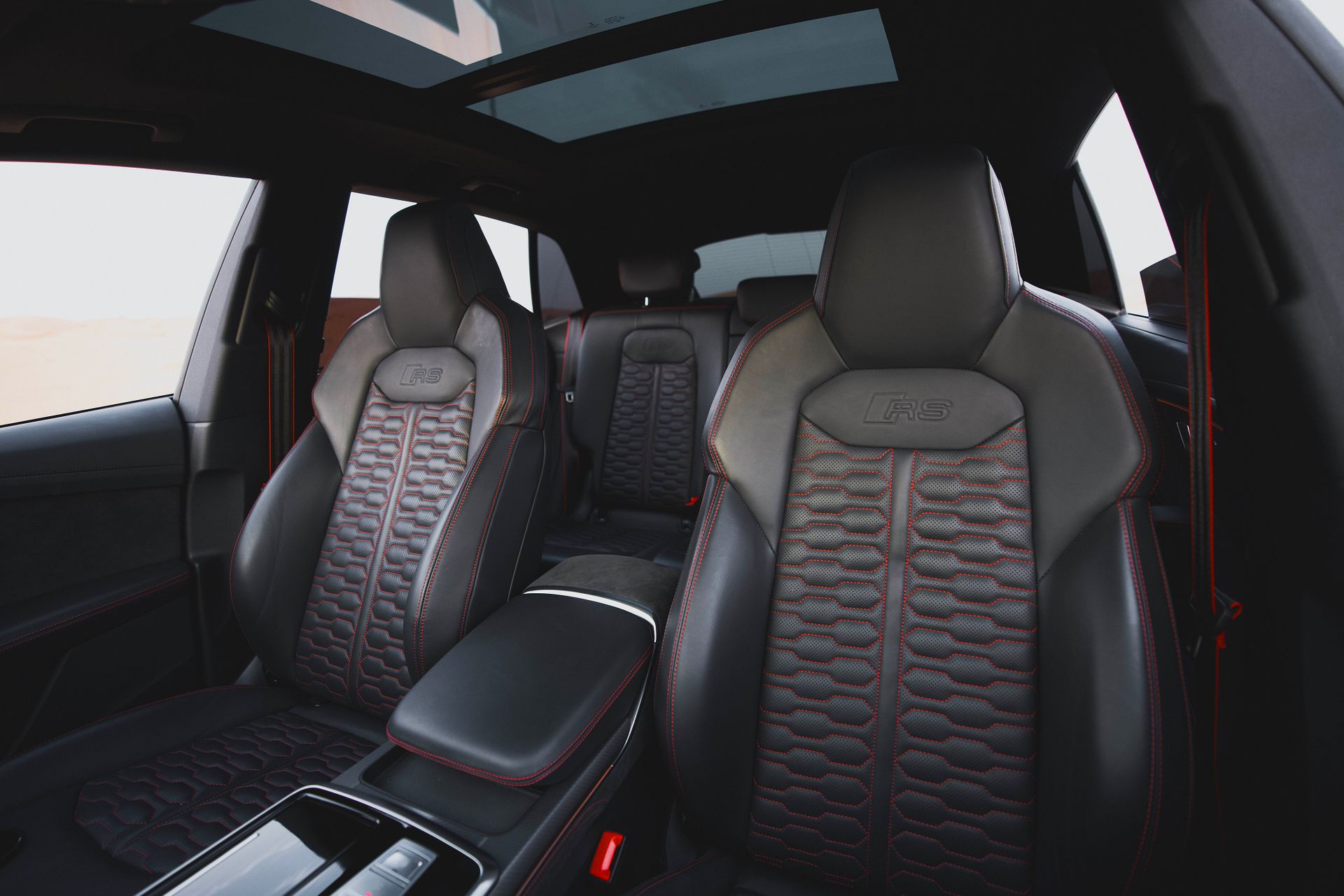 High-end automotive interior showcasing leather seats and panoramic sunroof for ultimate comfort and style.
