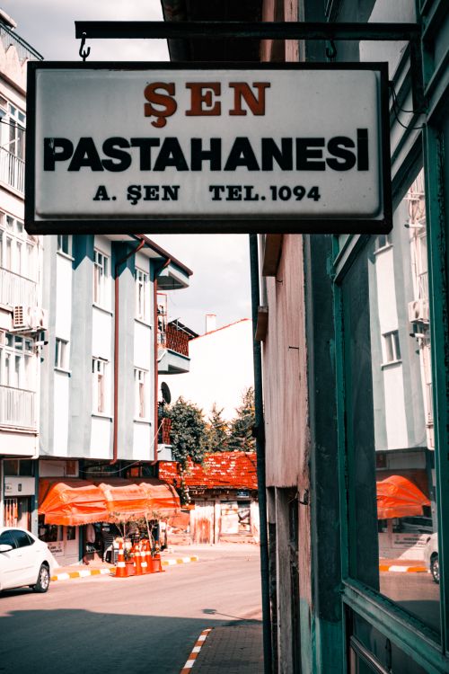 Free stock photo of hanging signs, old signage, pastry shop Stock Photo