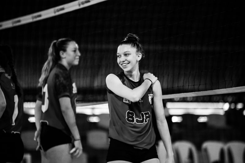 Volleyball team in action on an indoor court