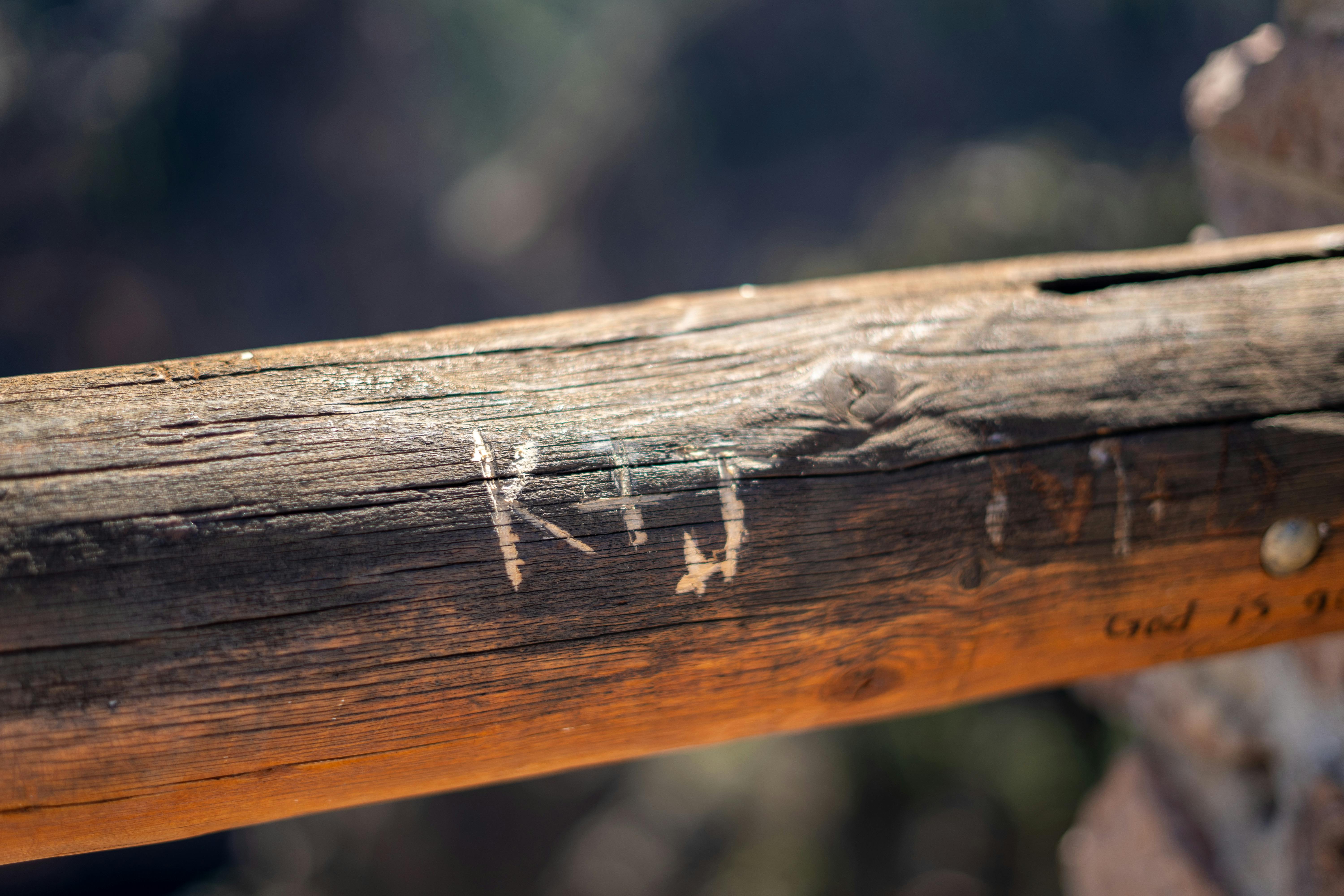 Weathered Wooden Railing with Carvings · Free Stock Photo