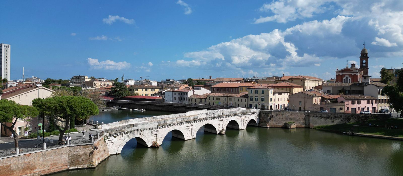 Scenic view of Tiberius Bridge over the Marecchia River in Rimini, Italy.