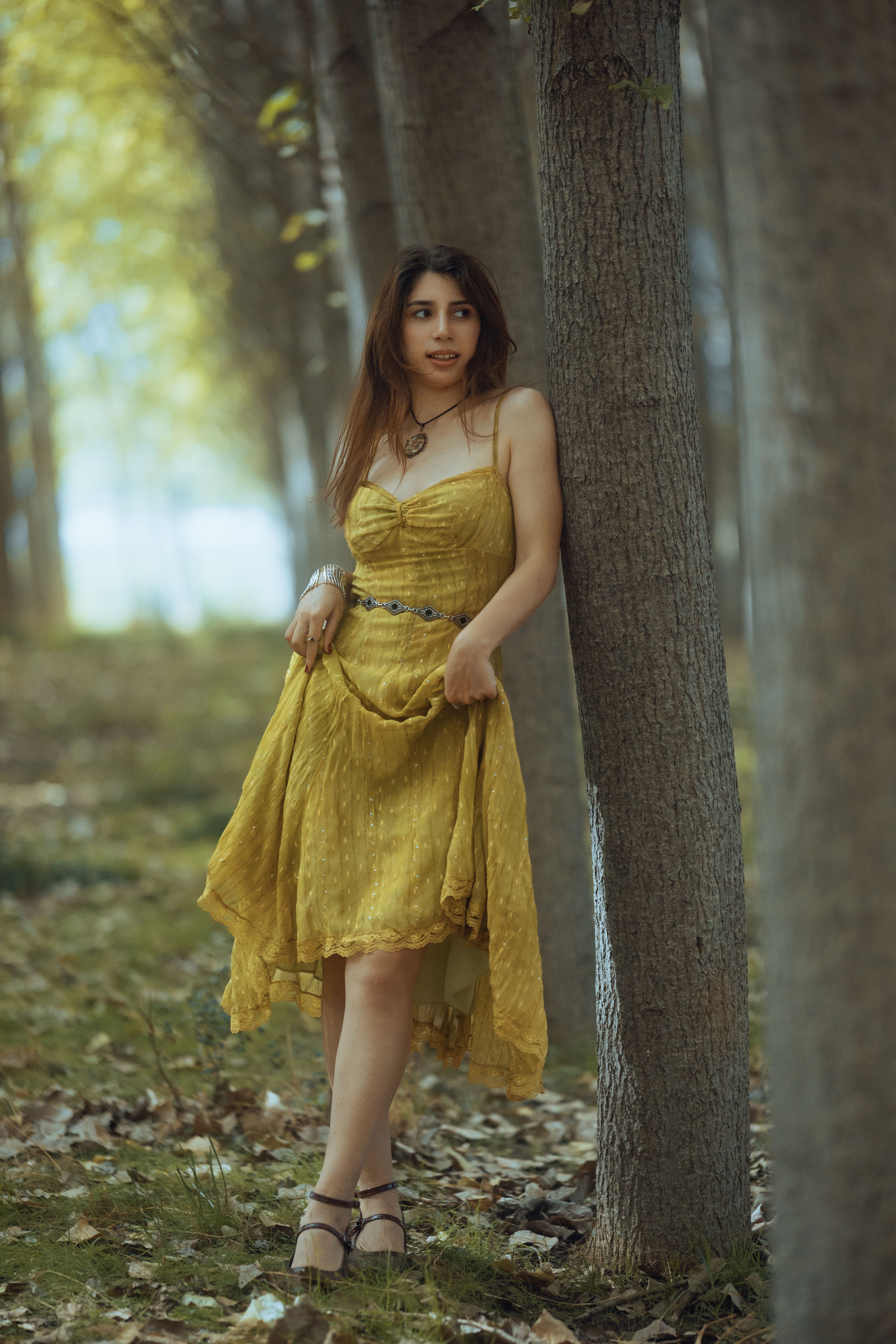 Young Woman in Yellow Dress in Forest Setting · Free Stock Photo