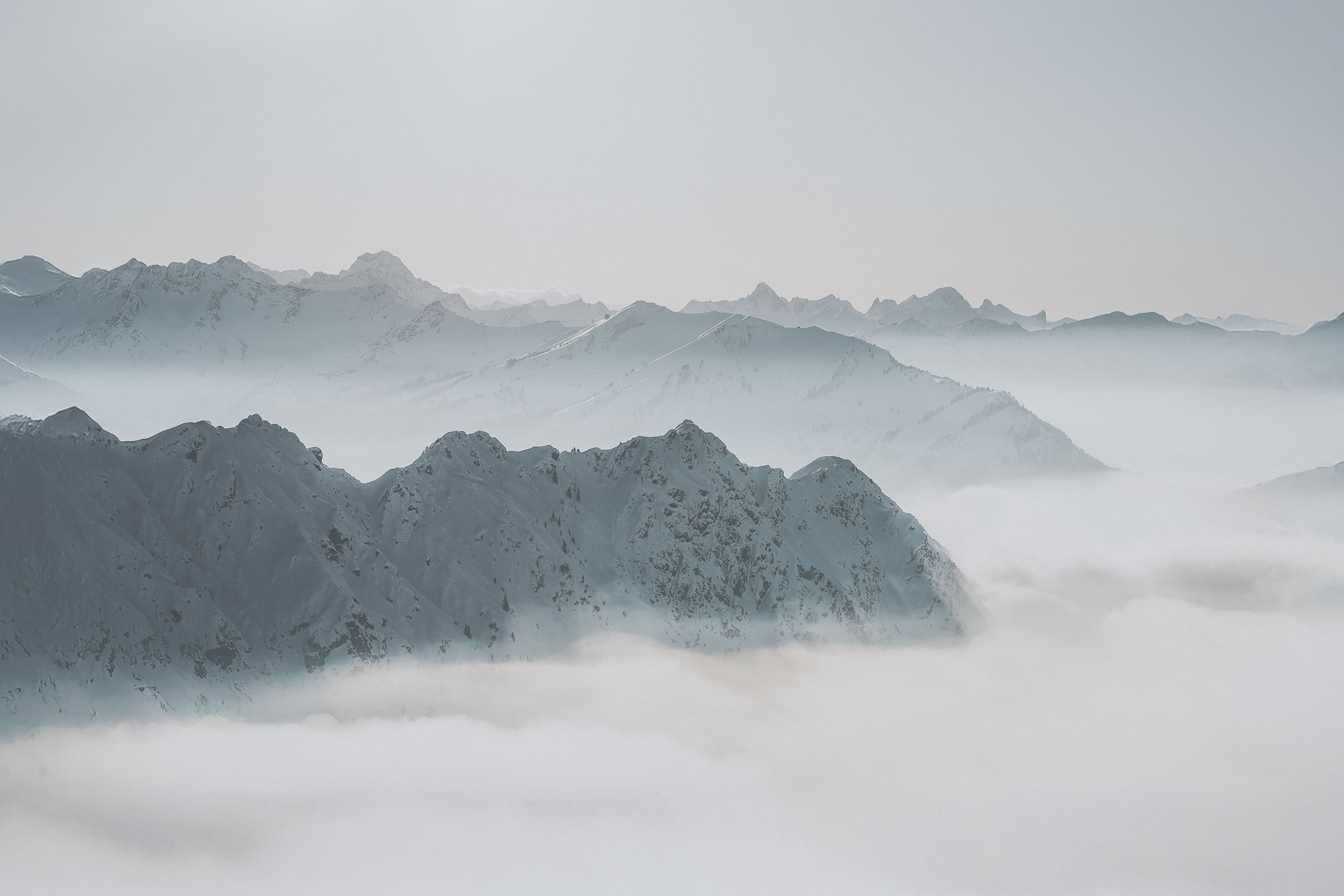 Serene Snow-Covered Mountain Peaks in Winter · Free Stock Photo