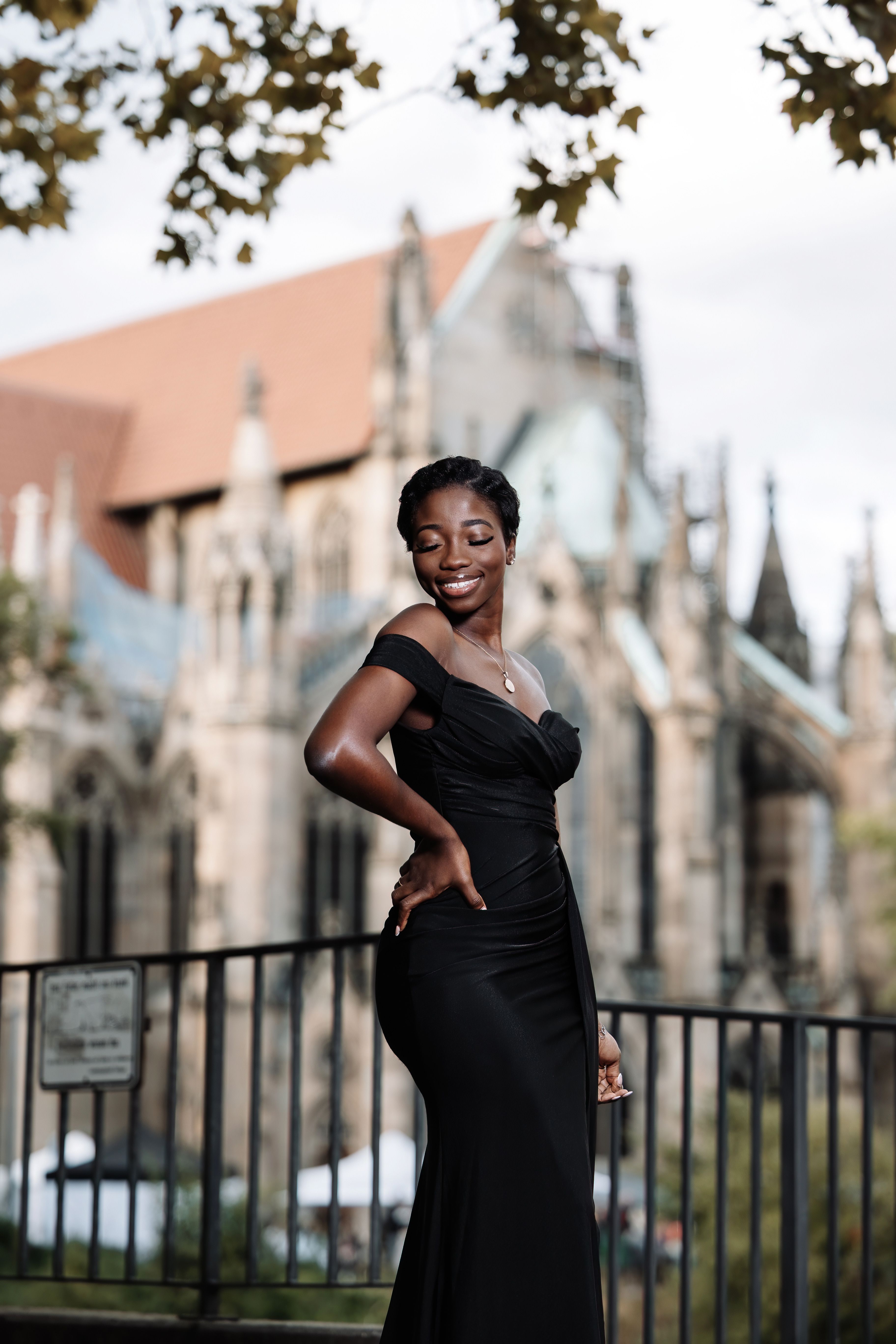 Elegant Woman in Black Dress Near Stuttgart Cathedral · Free Stock Photo