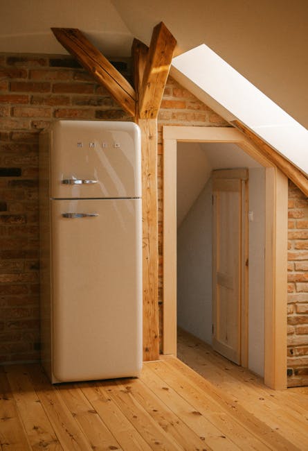 A vintage cream refrigerator in a rustic brick loft with natural wood accents.