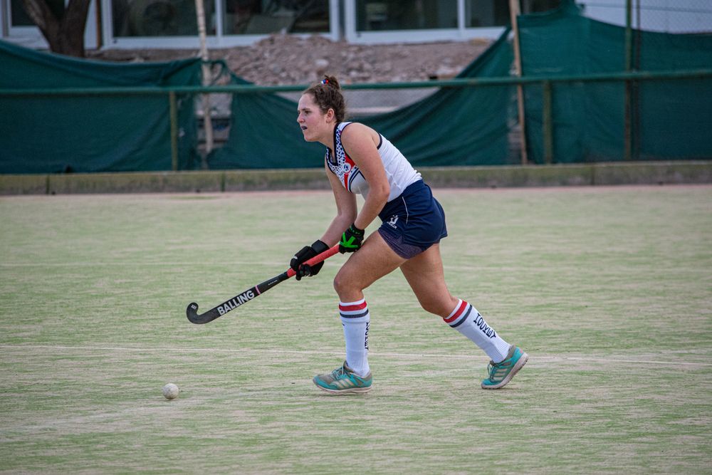 Field hockey player wearing a performance match jersey during play