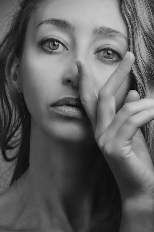 Grayscale Close-up Photo of Woman Posing