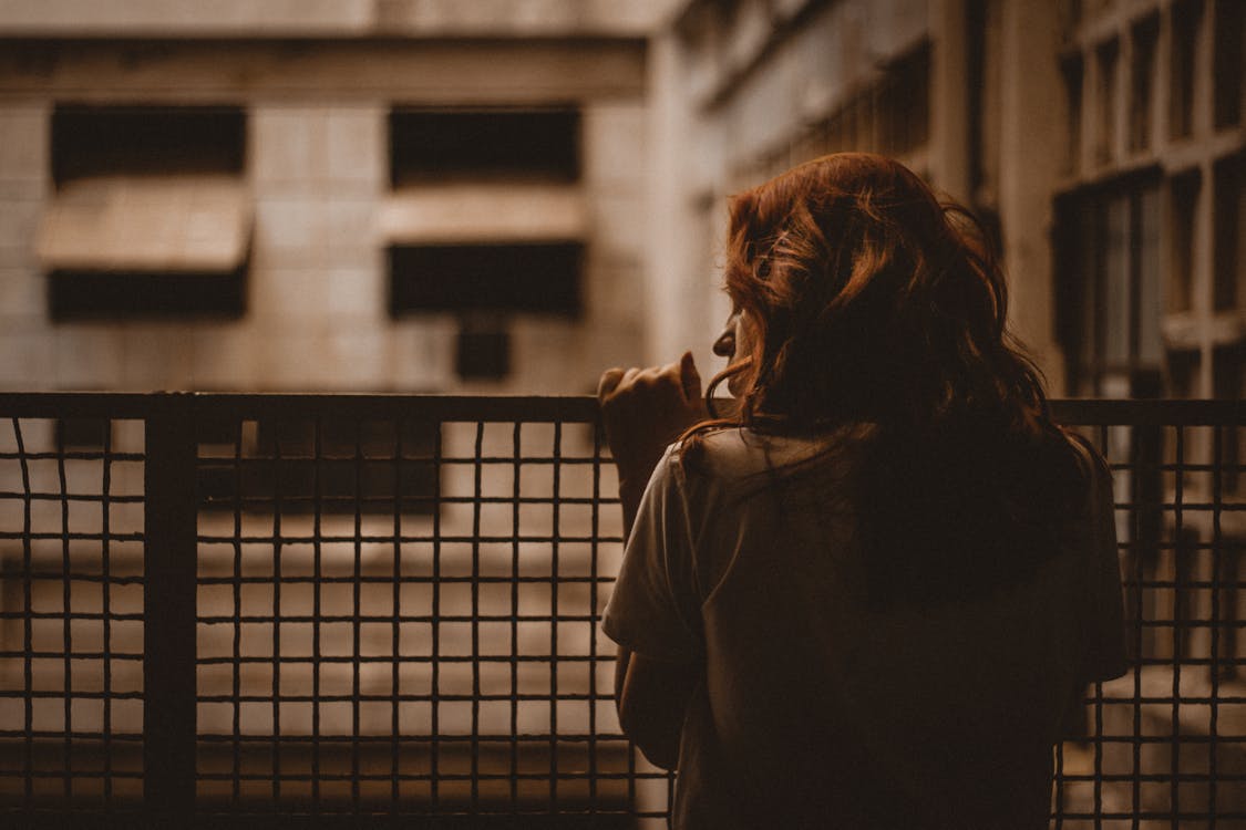 Free Woman Holding on Railings Stock Photo