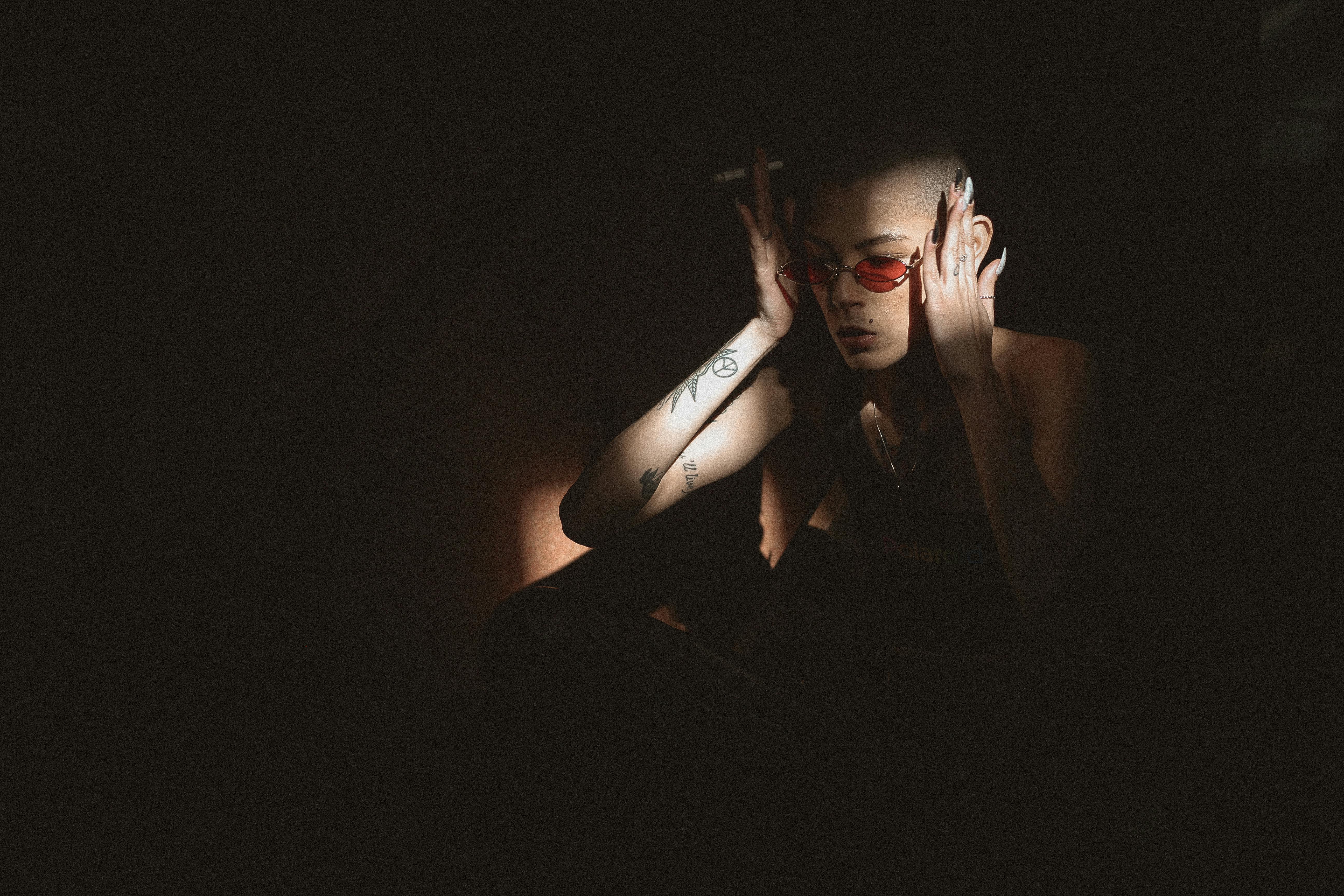 woman wearing red sunglasses