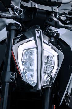 Detailed view of a futuristic motorcycle headlight design.