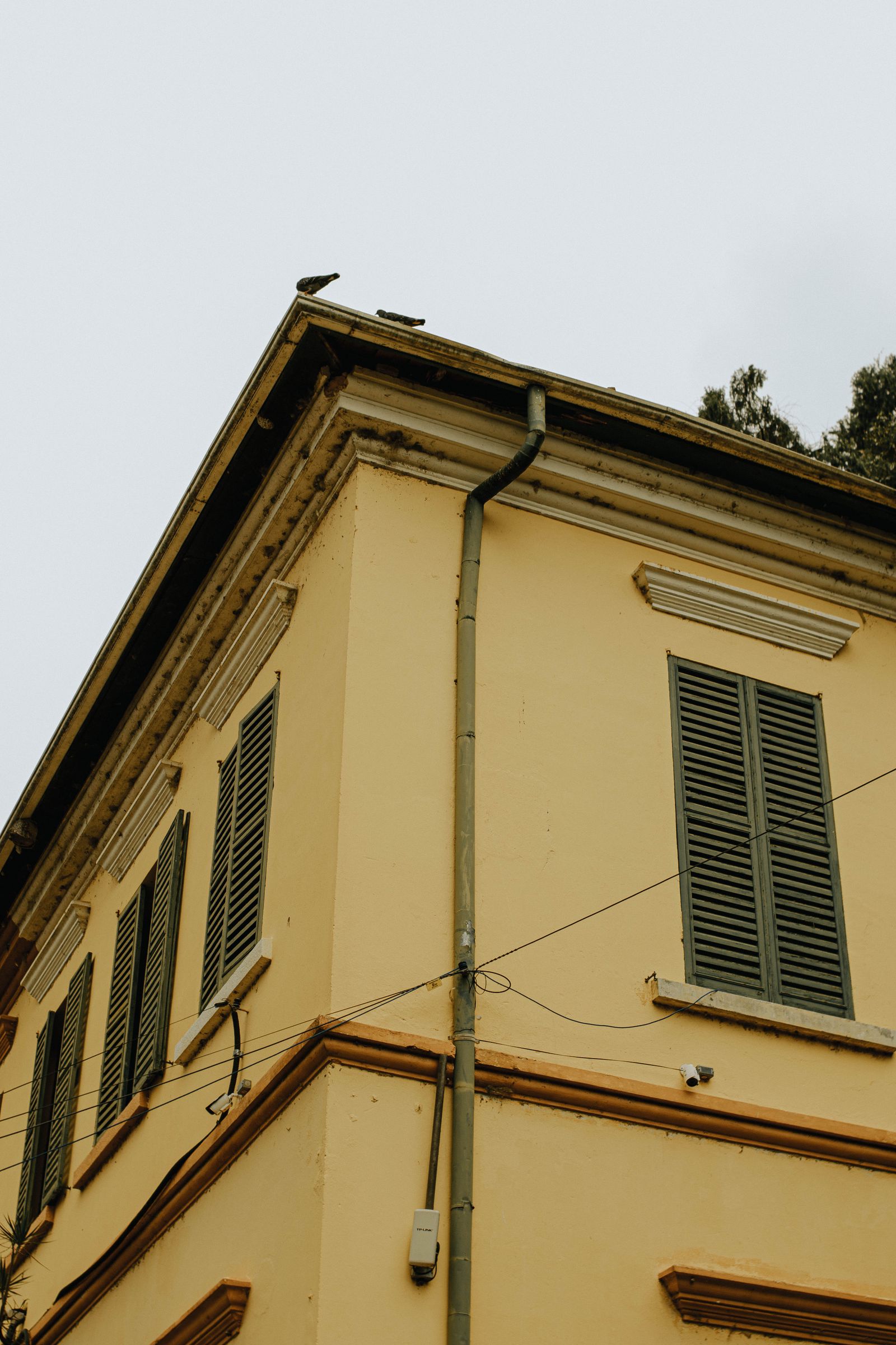 Old house with gutters and downspout — How Much Does a Small Business Website Cost in 2026?