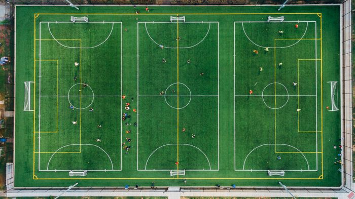 Football pitch seen from directly above — photo by K on Pexels