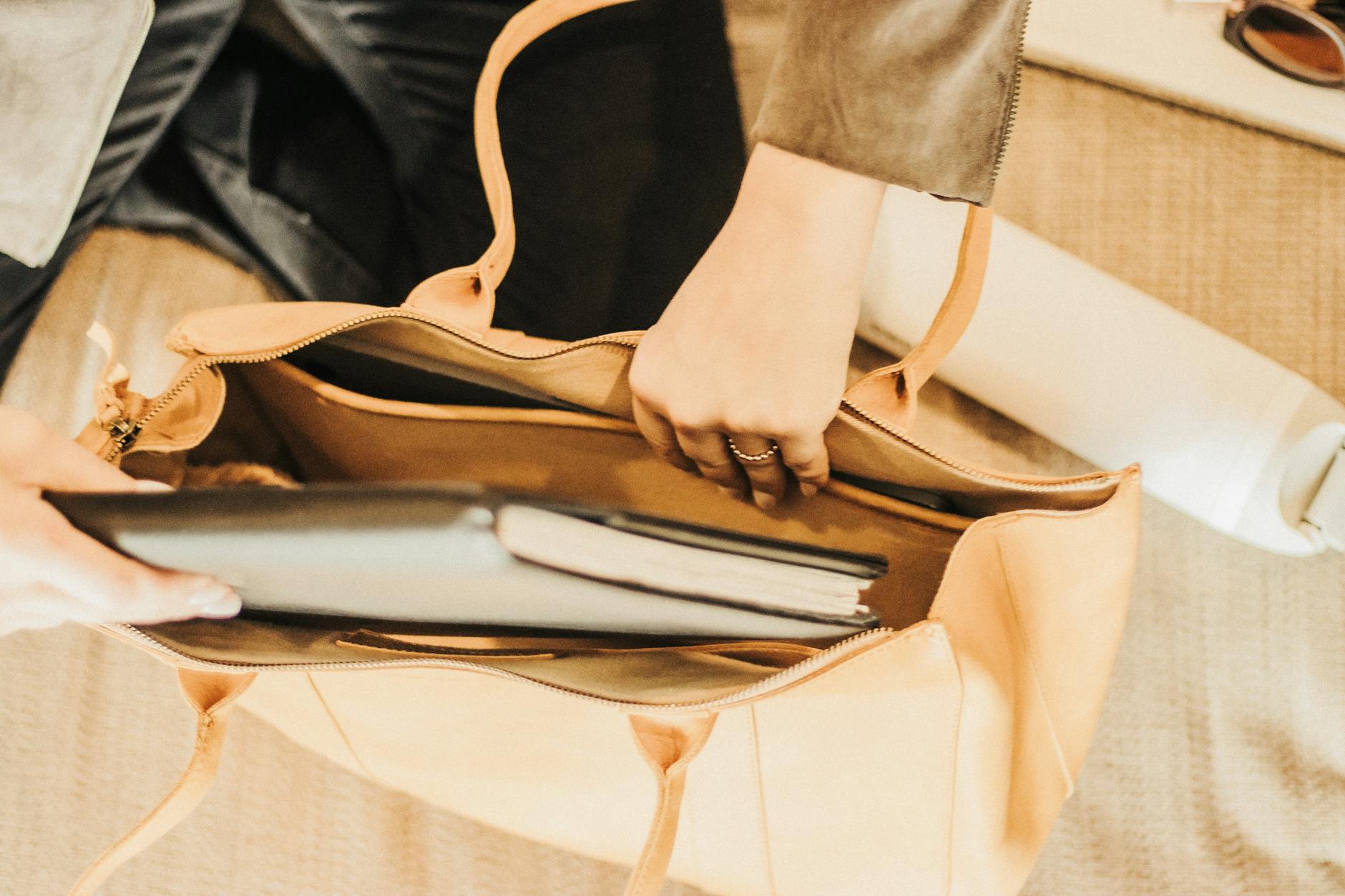 Structured Leather Tote Bag In Neutral Colors With Strong Straps, Standing Upright And Filled With Essentials