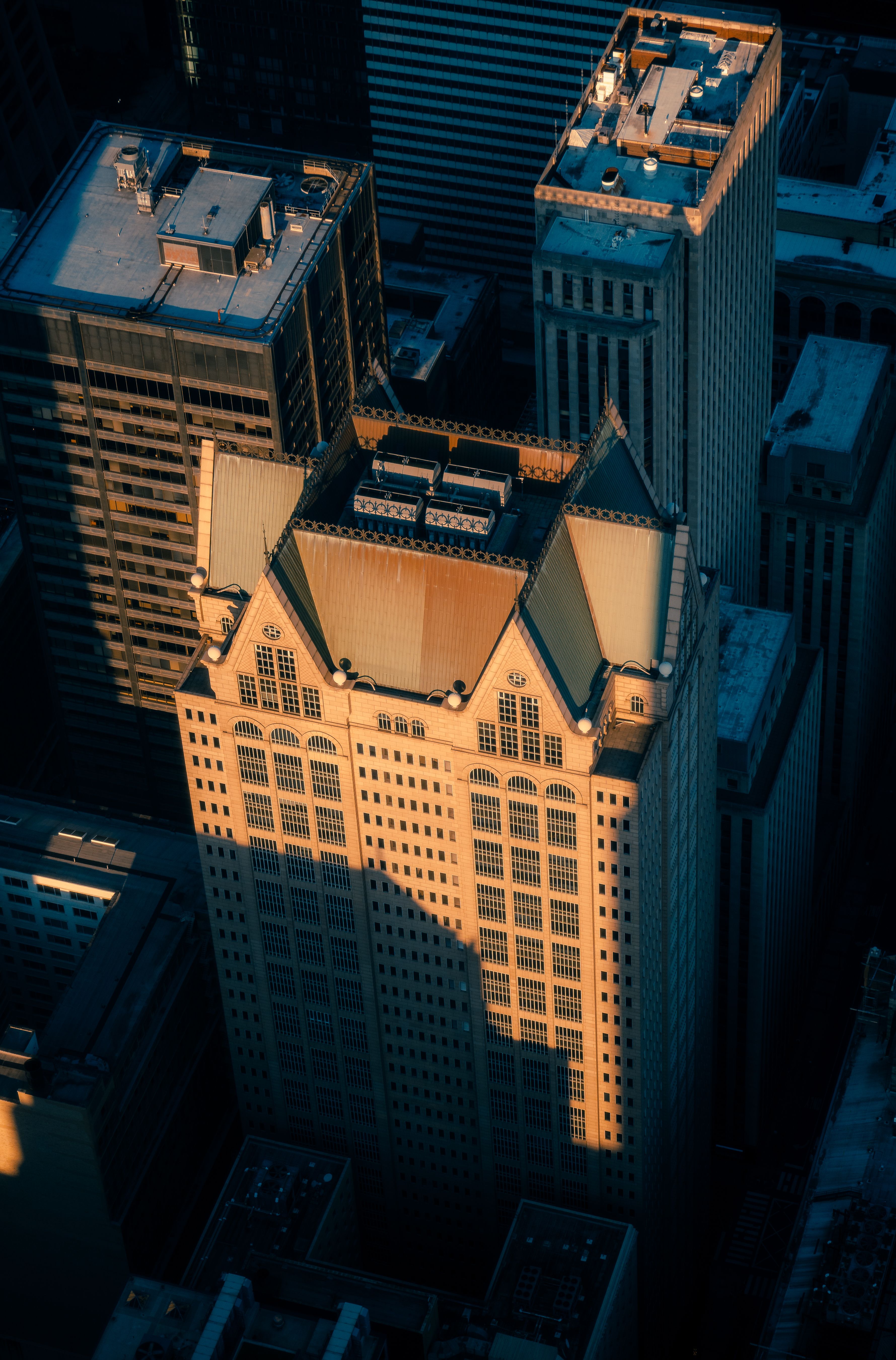 Aerial View of Sunlit Skyscrapers in Urban Cityscape · Free Stock Photo