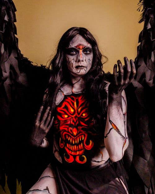 Free Intriguing surreal portrait of a woman with gothic horror makeup and costume. Stock Photo