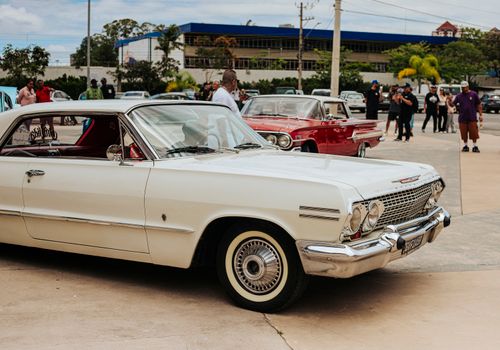 Free Vintage cars on display during an outdoor automotive gathering, showcasing classic automotive design. Stock Photo