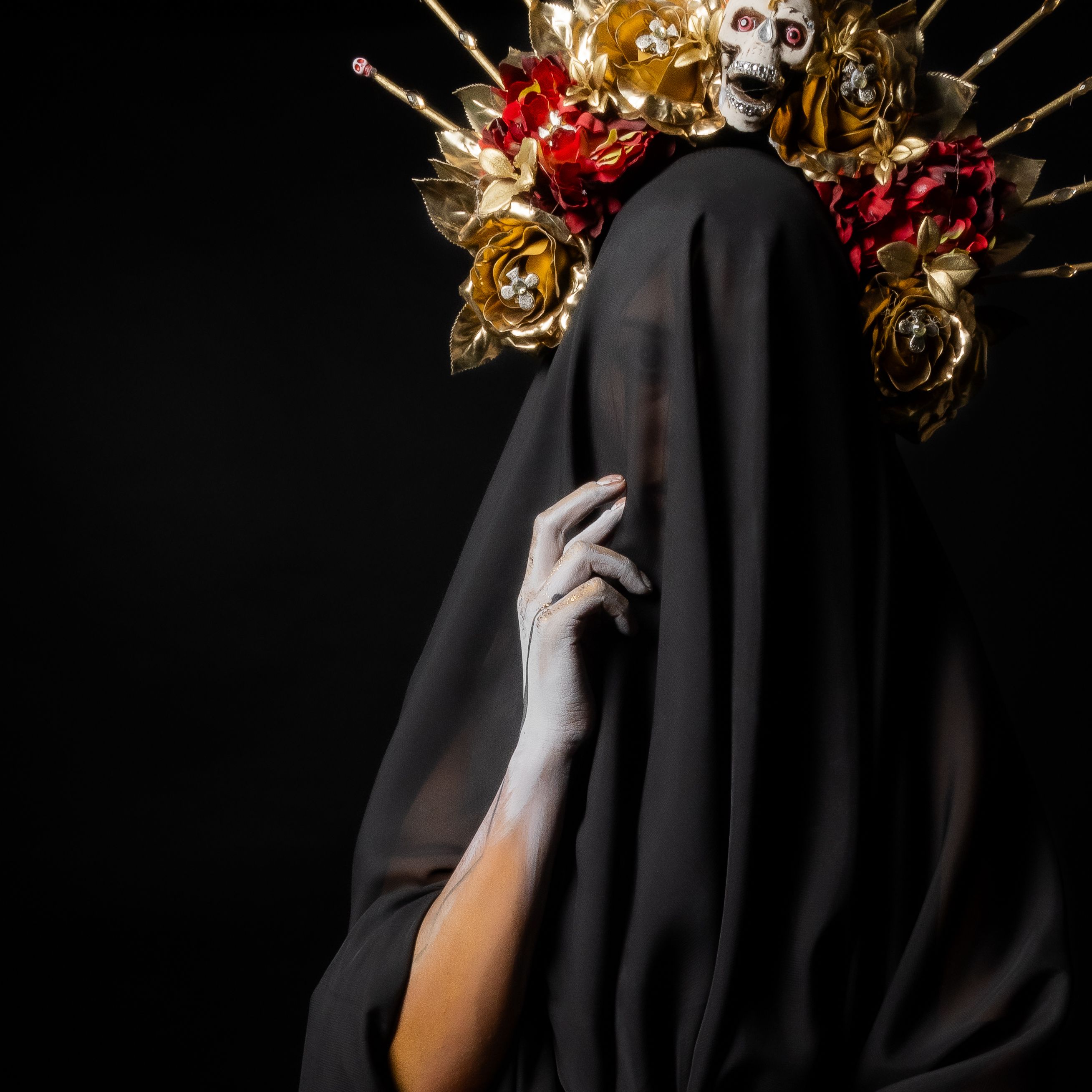 A haunting surreal portrait featuring a veiled figure with an ornate skull headdress.
