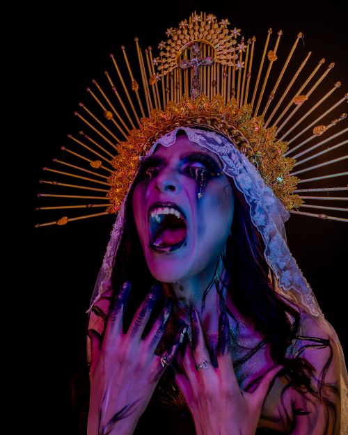 Free A haunting surreal portrait with gothic elements and colorful makeup evokes a powerful sense of fantasy. Stock Photo