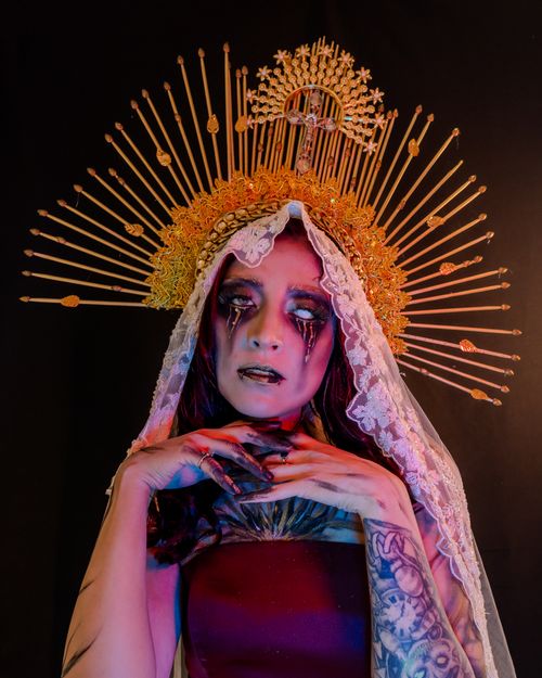 Free A striking surreal portrait featuring gothic horror makeup and a celestial headpiece, perfect for Halloween themes. Stock Photo