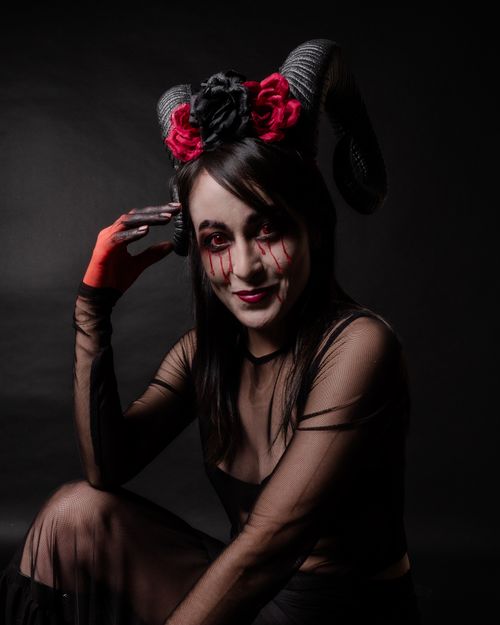 Free Captivating dark fantasy portrait featuring surreal makeup and gothic theme. Stock Photo
