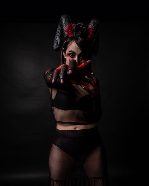 Free Dark and surreal fantasy portrait featuring a woman with gothic makeup and costume. Stock Photo