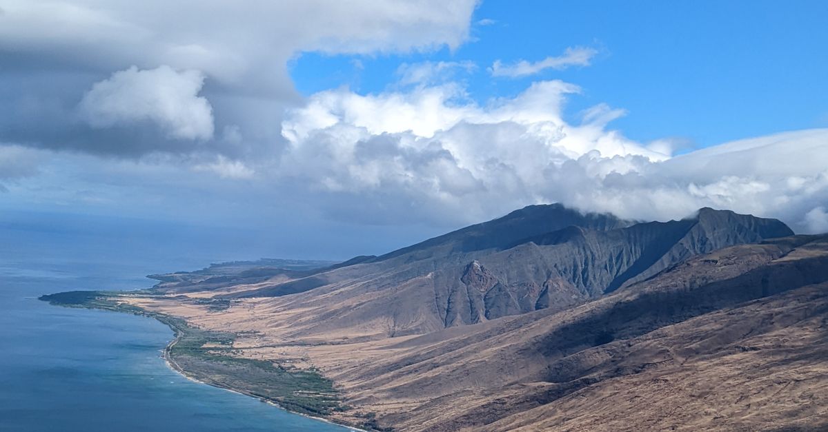 Photo by Elisa M A stunning aerial shot of Maui's coastline showcasing the island's dramatic landscape and vast ocean view.