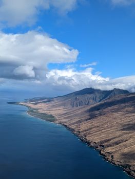 Photo by Elisa M A stunning aerial shot of Maui's coastline showcasing the island's dramatic landscape and vast ocean view.