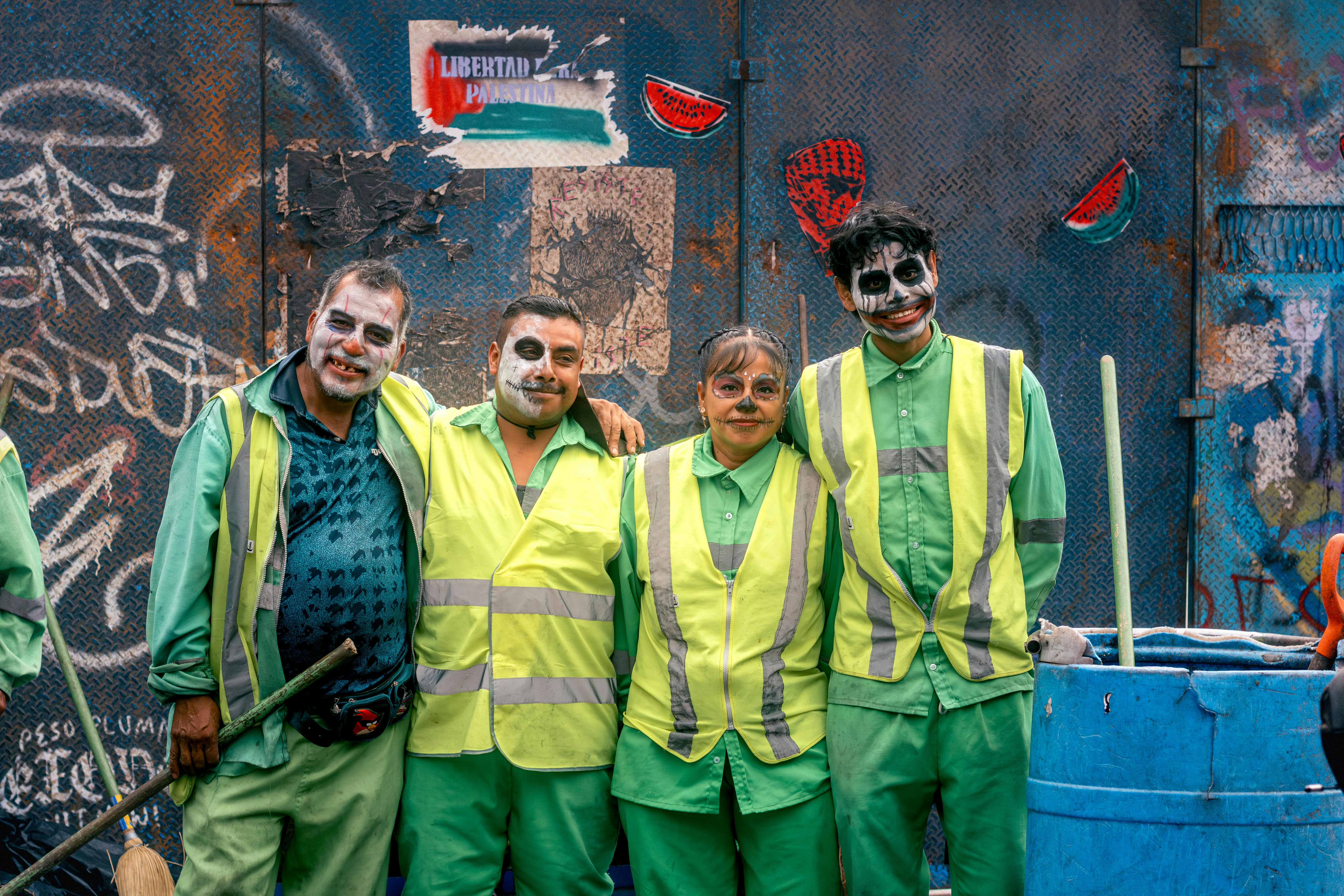 day of the dead celebrants in street art backdrop