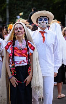 Participants in traditional attire celebrating Day of the Dead with colorful face paint.