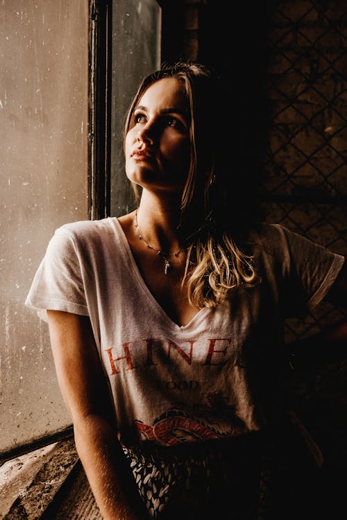 Photo Of Woman Leaning On Wall