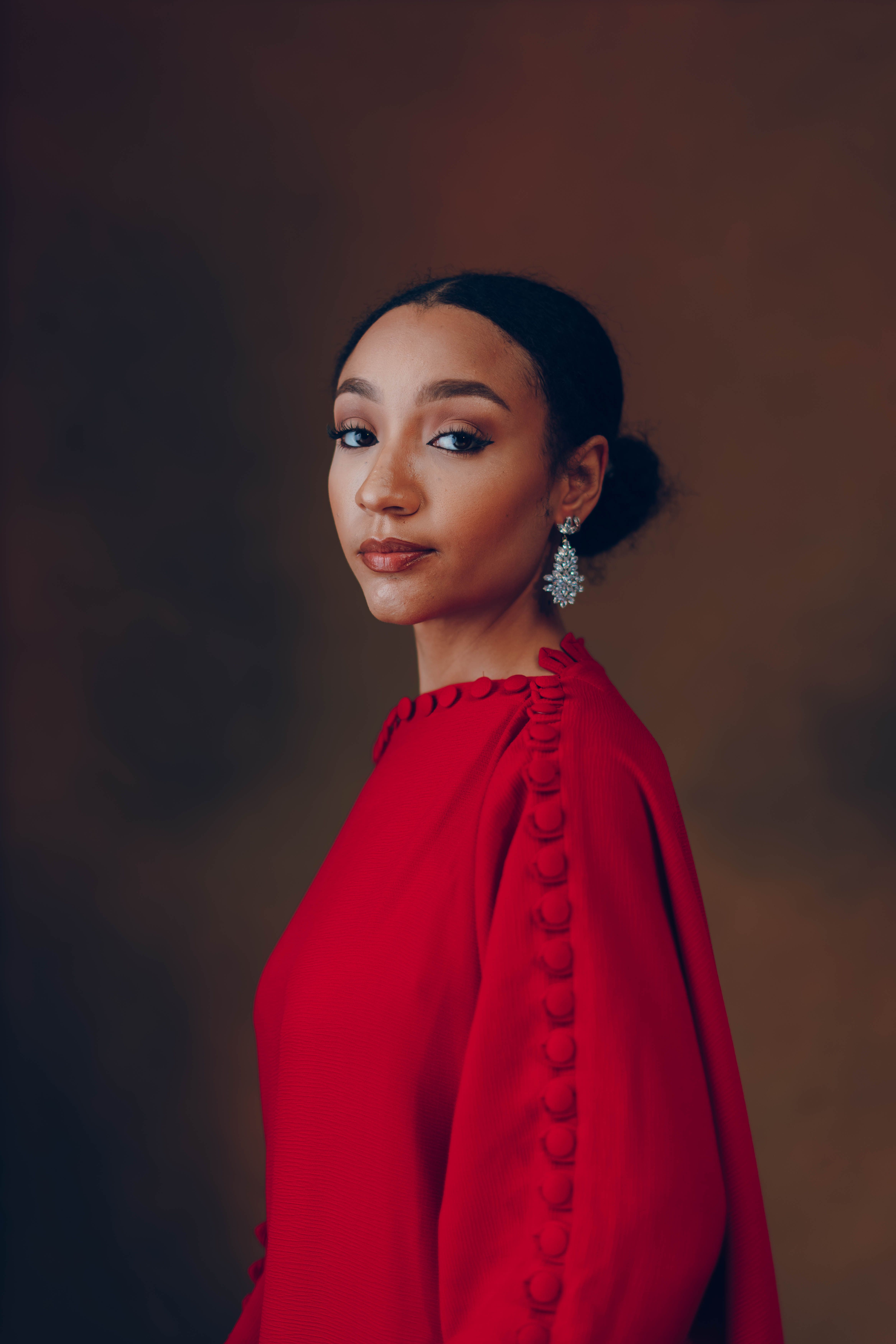 Elegant Woman in Red Dress with Earrings · Free Stock Photo