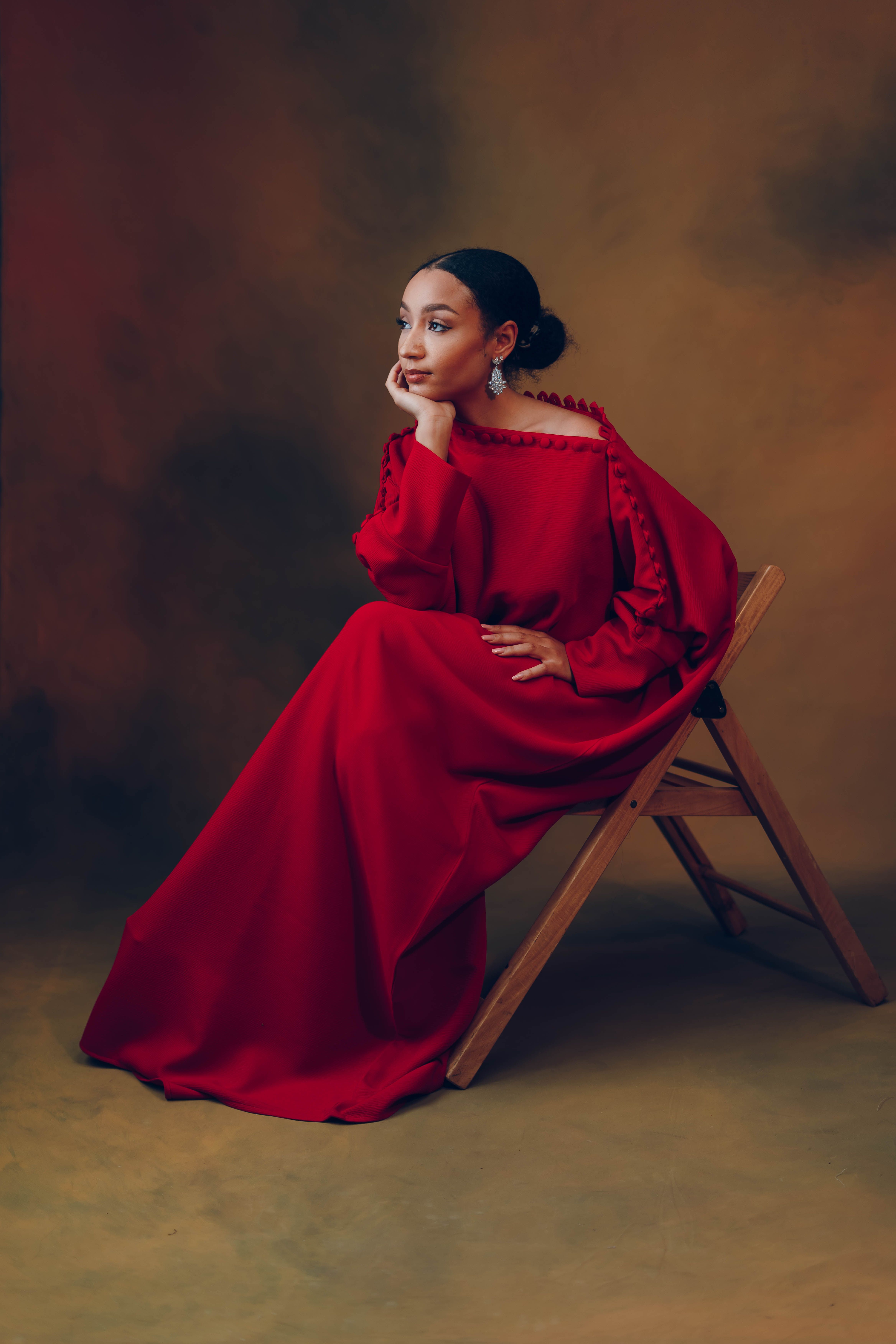 Elegant Woman in Red Dress Sitting on Chair · Free Stock Photo