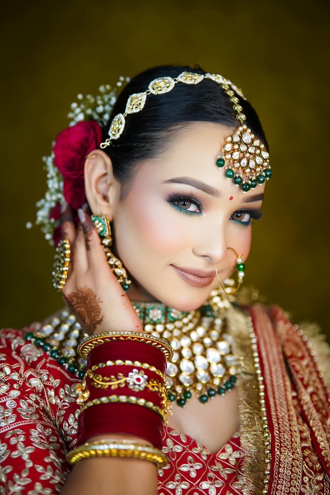 Bridal portrait highlighting a fitted mermaid-style lehenga with ornate work