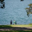 Family Stroll by the Lakeside in Summer