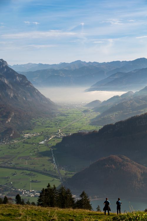 Free A stunning view of the Alpine valley in Walenstadt, Switzerland, showcasing misty mountains and lush greenery. Stock Photo